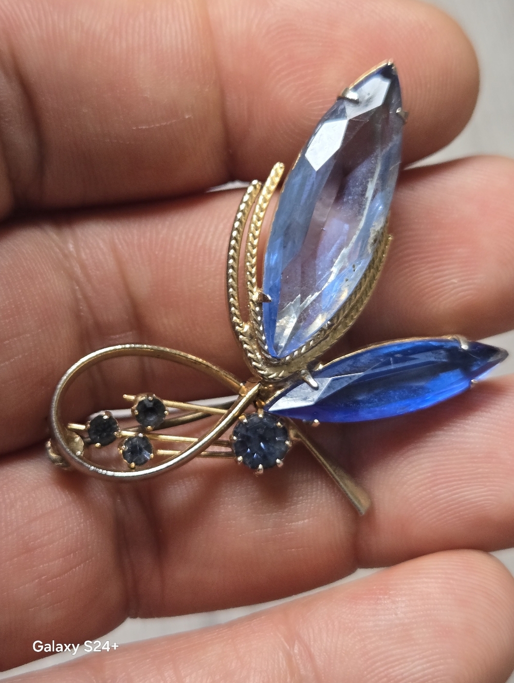 Gold-Tone Brooch with Light and Deep Blue Faceted Stones